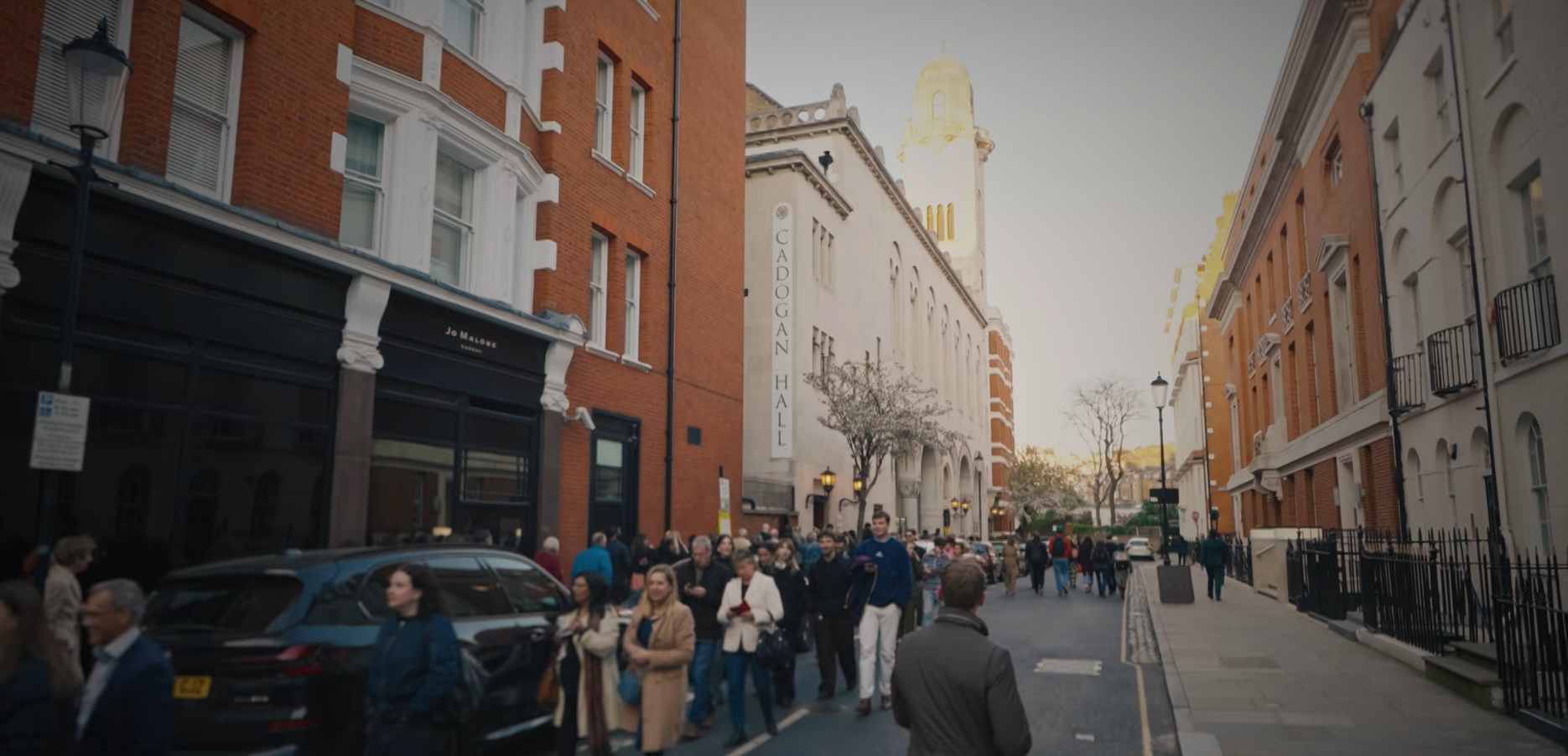 External photograph of people arriving at Cadogan Hall
