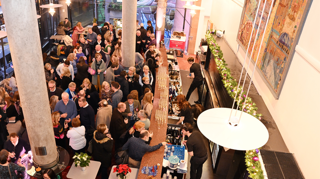 Photograph of people in a theatre bar