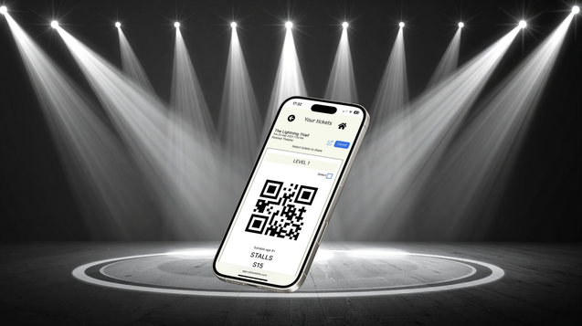 black and white picture of a mobile phone on a stage