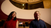 colour photograph of couple in theatre foyer